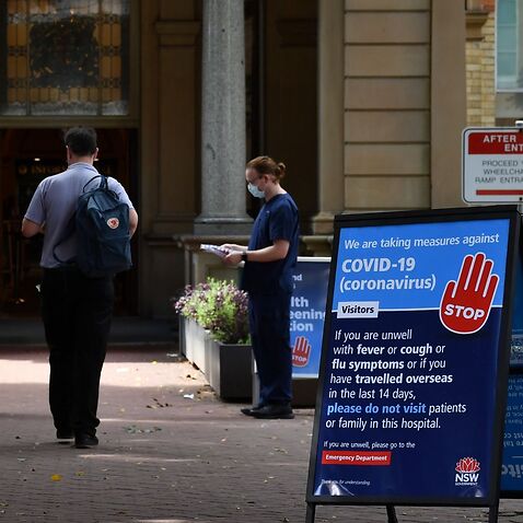 Staff wearing face masks outside the Royal Prince Alfred Hospital (RPA) in Camperdown, Sydney, Wednesday, March 25, 2020