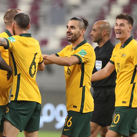 Awer Mabil celebrates a goal with his Socceroos teammates