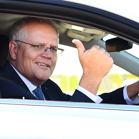 Prime Minister Scott Morrison drives a hydrogen-fuelled car around a Toyota test track in Melbourne, Tuesday, November 9, 2021. (AAP Image/Pool, William West) NO ARCHIVING