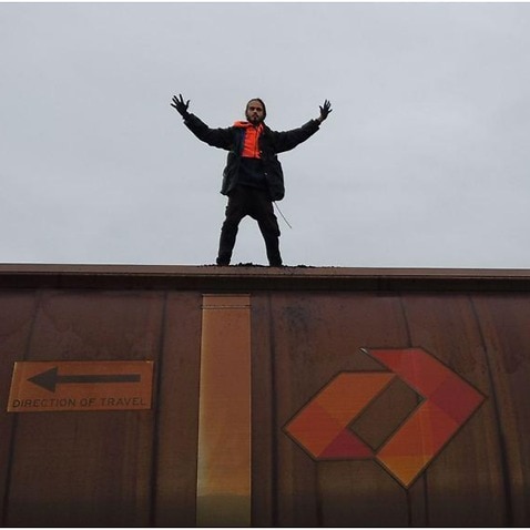 Eric Serge Herbert standing on a coal train in Newcastle.