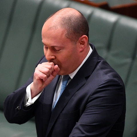 Treasurer Josh Frydenberg has a coughing fit as he makes a ministerial statement to the House of Representatives at Parliament House in Canberra, Tuesday, May 12, 2020. (AAP Image/Mick Tsikas) NO ARCHIVING