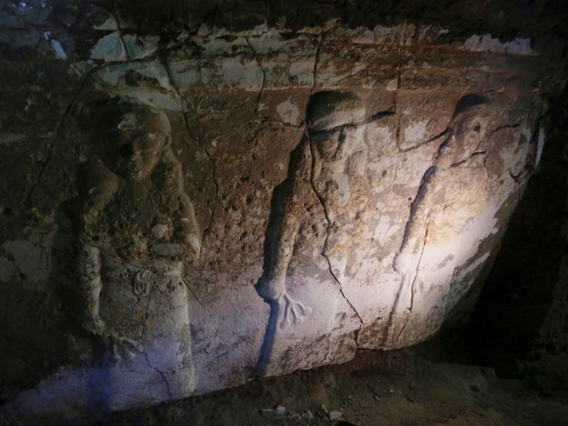 Ancient artefacts are seen inside a tunnel under rubble in Mosul