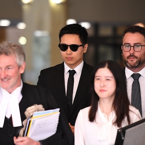 Chinese actor Yunxiang Gao (centre) leaves the Downing Centre court in Sydney, Friday, January 25, 2019. (AAP Image/Joel Carrett) NO ARCHIVING