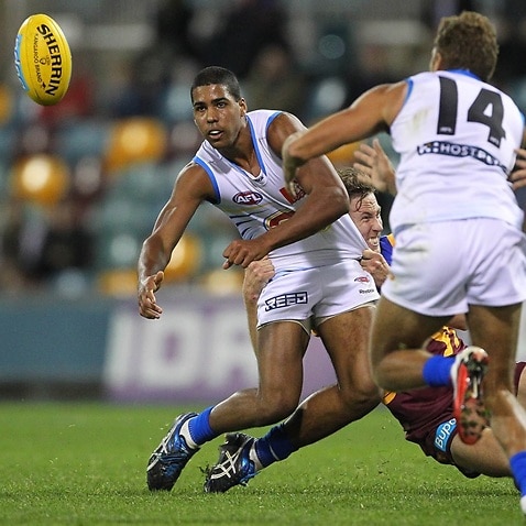 Joel Wilkinson (left) & Nathan Krakouer (right) during the round 21 game between the Brisbane Lions and Gold Coast Suns on Saturday, Aug. 13, 2011. 