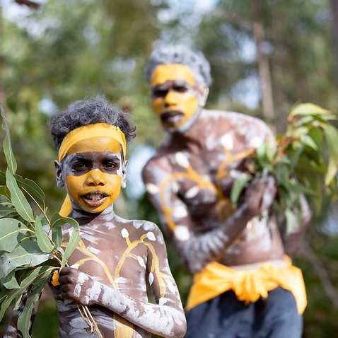 Members of the Gumatj clan prepare for bunggul (traditional dance) at the Garma Festival in northeast Arnhem Land, Saturday, August 3, 2019 (AAP Image/Supplied by Yothu Yindi Foundation, Peter Eve) NO ARCHIVING, EDITORIAL USE ONLY