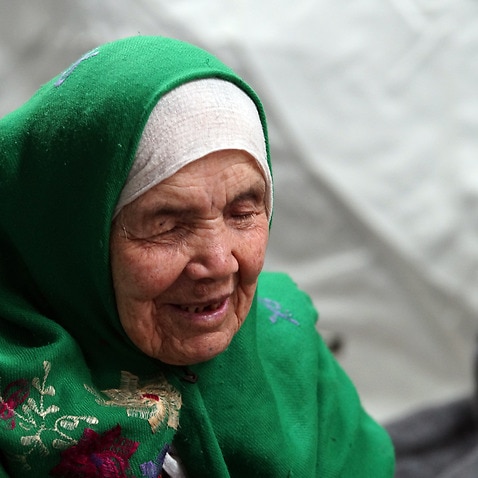 Bibihal Uzbeki from Kunduz, Afghanistan, rests in Croatia's main refugee camp in 2015. 