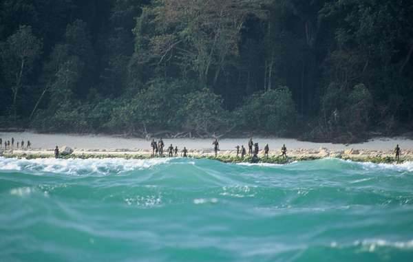 The Sentinelese stand guard on an island beach.