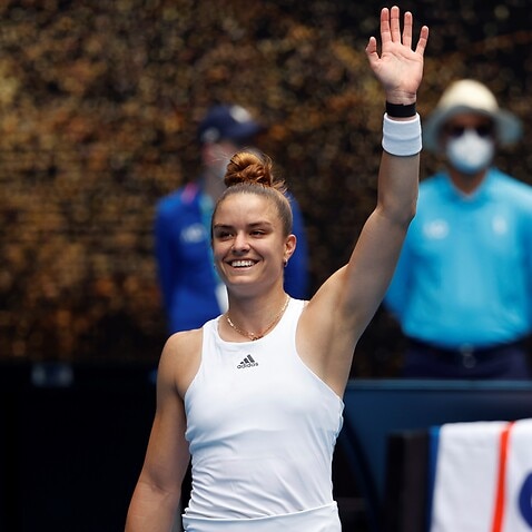 Maria Sakkari of Greece waves after defeating Tatjana Maria of Germany in their first round match at the Australian Open tennis championships in Melbourne, Australia, Monday, Jan. 17, 2022. (AP Photo/Hamish Blair)