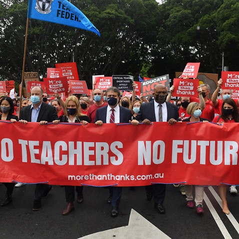 Teachers march on Parliament House during a strike by NSW public school teachers and principals in Sydney, Tuesday, 7 December, 2021.
