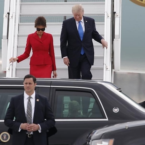 Donald Trump and First Lady Melania arrive at Orly airport
