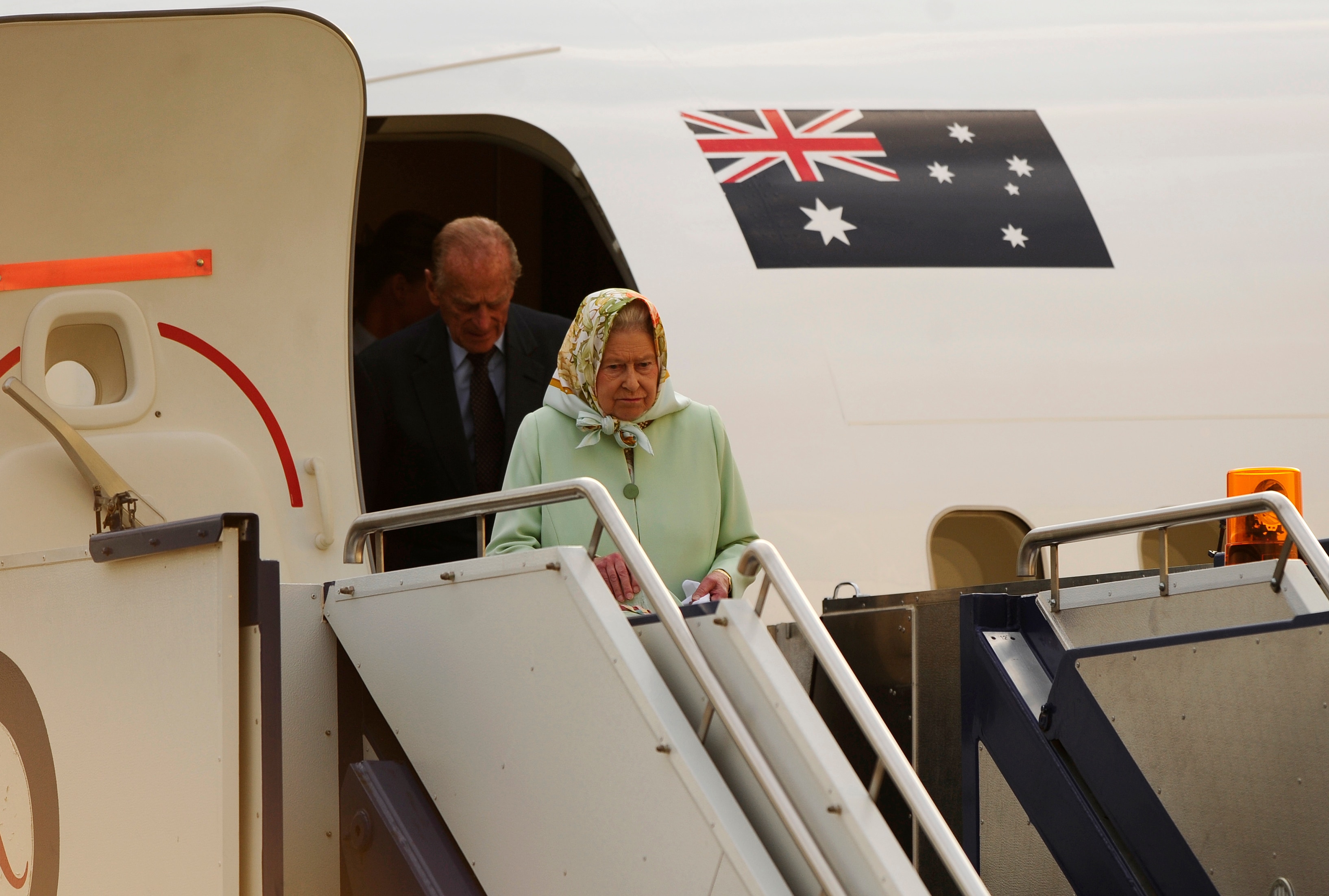Queen Elizabeth II and The Duke of Edinburgh Prince Philip arrive at Defence Establishment Fairbairn in Canberra after their visit to Brisbane on Monday, Oct. 24, 2011. (AAP Image/Stuart Walmsley) NO ARCHIVING