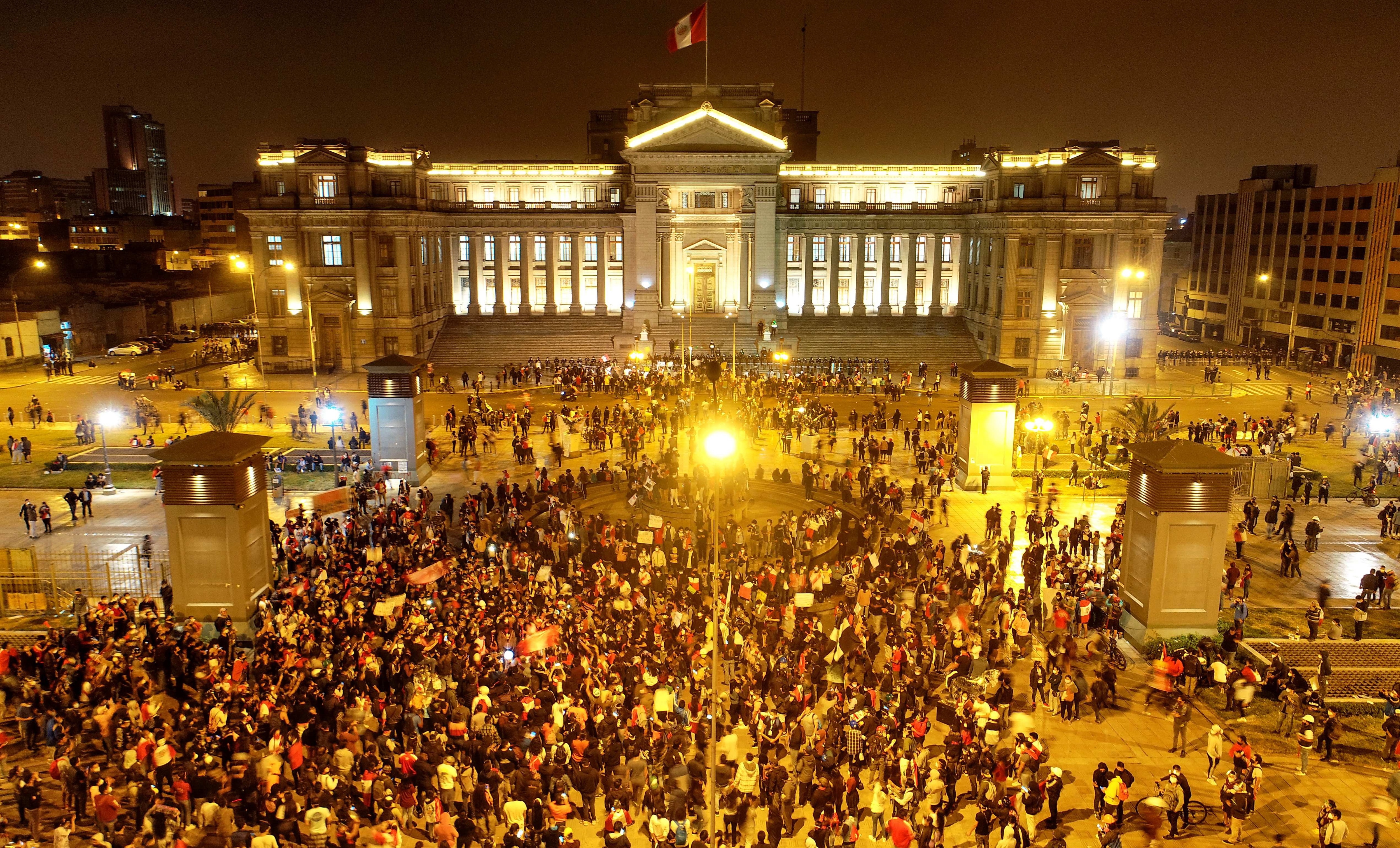 People take part in a protest against the new government of President Manuel Merino, in San Martin de Lima square, in Lima, Peru.