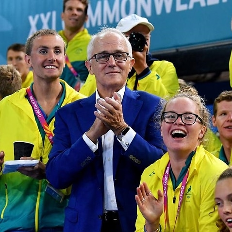 Malcolm Turnbull was seen fumbling the lyrics to John Farnham's 'The Voice' at the Commonwealth Games. 