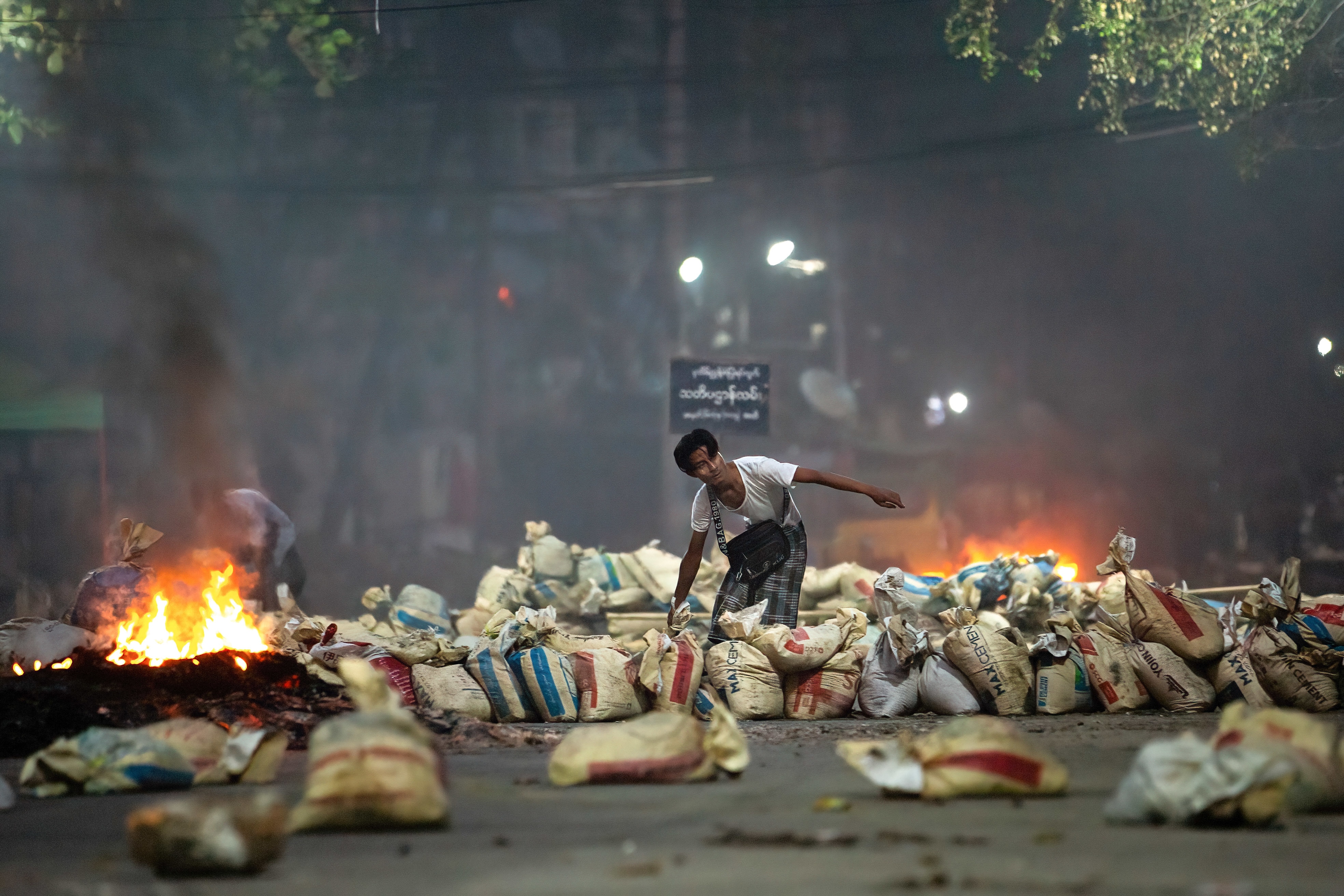 A protester pilling bags as barricades during a demonstration in March