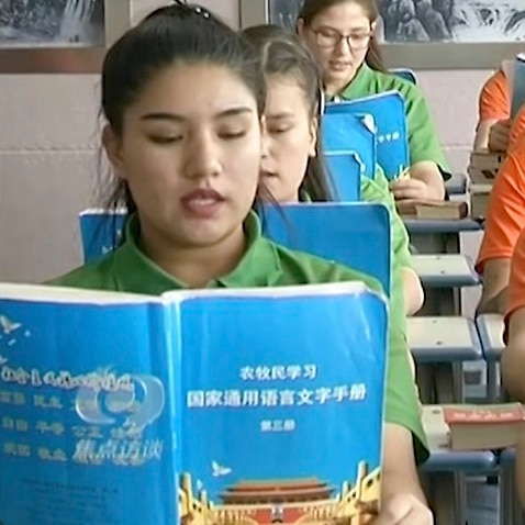 Young Muslims read from official Chinese language textbooks in classrooms at the Hotan Vocational Education and Training Center in Hotan, Xinjiang.