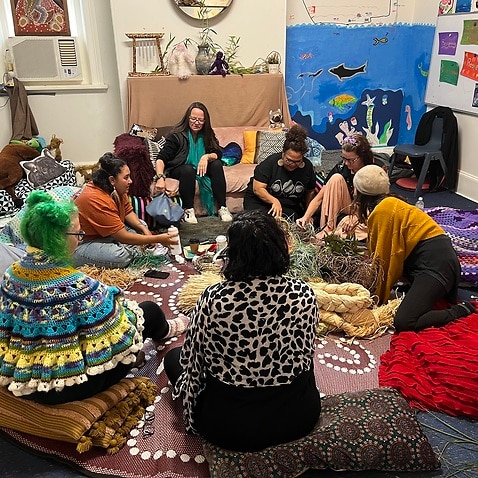 A weaving circle at the healing hub (SBS - Sandra Fulloon)