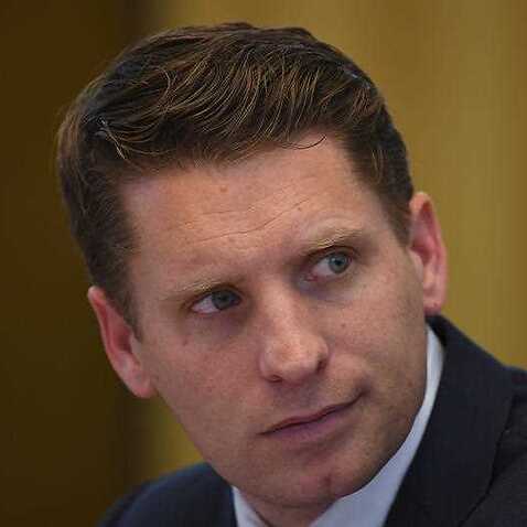 Committee chair Andrew Hastie reacts during a hearing of the Parliamentary Joint Committee on Intelligence and Security at Parliament House.