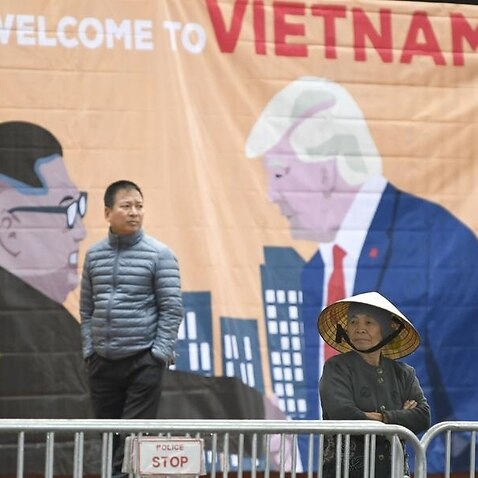 A banner with images of the US President and the North Korean leader