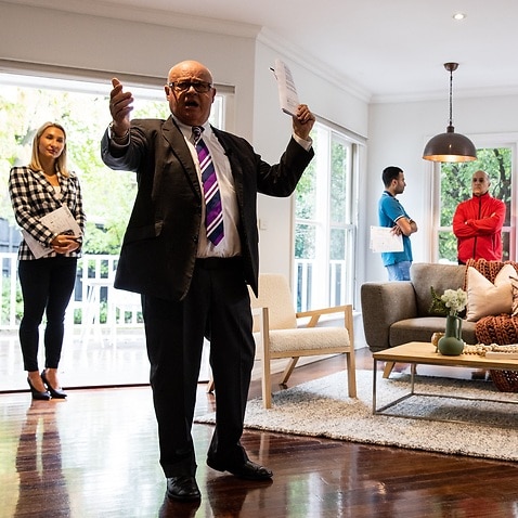 An auction director conducts an auction on a property at Glen Iris in Melbourne (AAP)