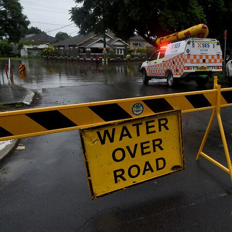 Floodwater submerges the road on the corner of Ladbury Ave and Memorial Ave, in Penrith, NSW, Sunday, 21 March, 2021. 