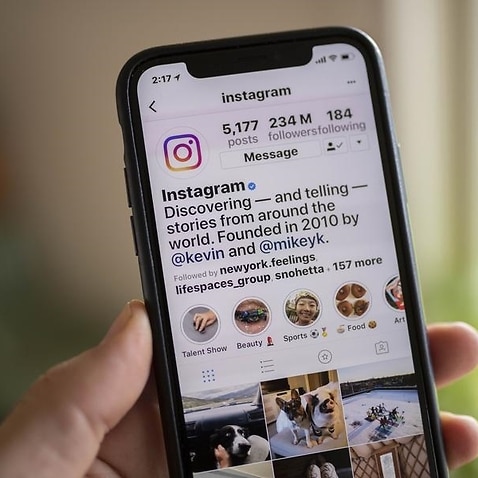 A smart phone is seen displaying the social media app Instagram