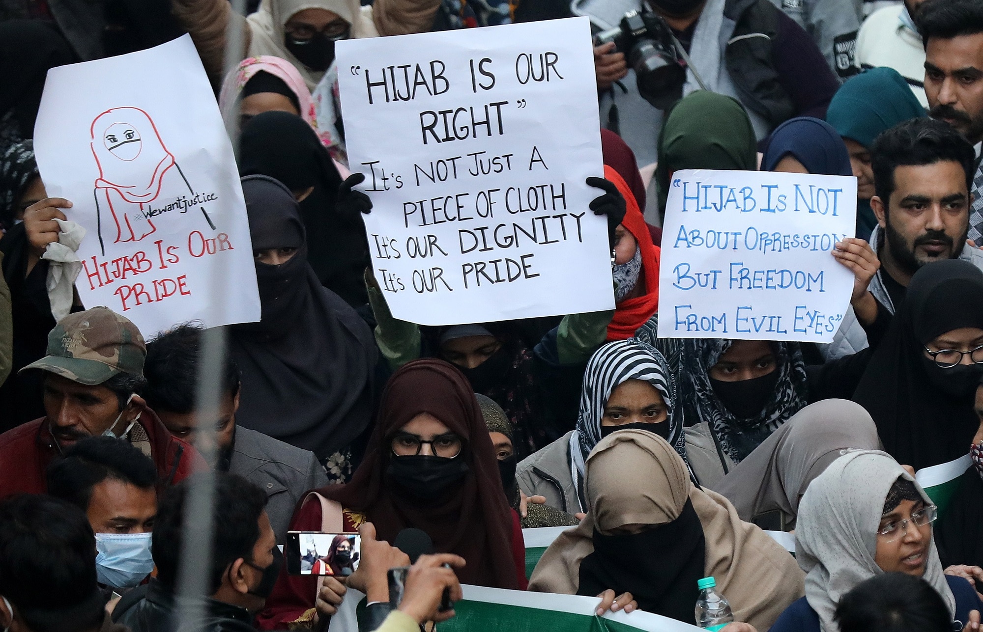 All India Majlis-E-Ittehadul Muslimeen (AIMIM) members and supporters hold a protest against the hijab ban at Shaheen Bagh in New Delhi on 9 February 2022.
