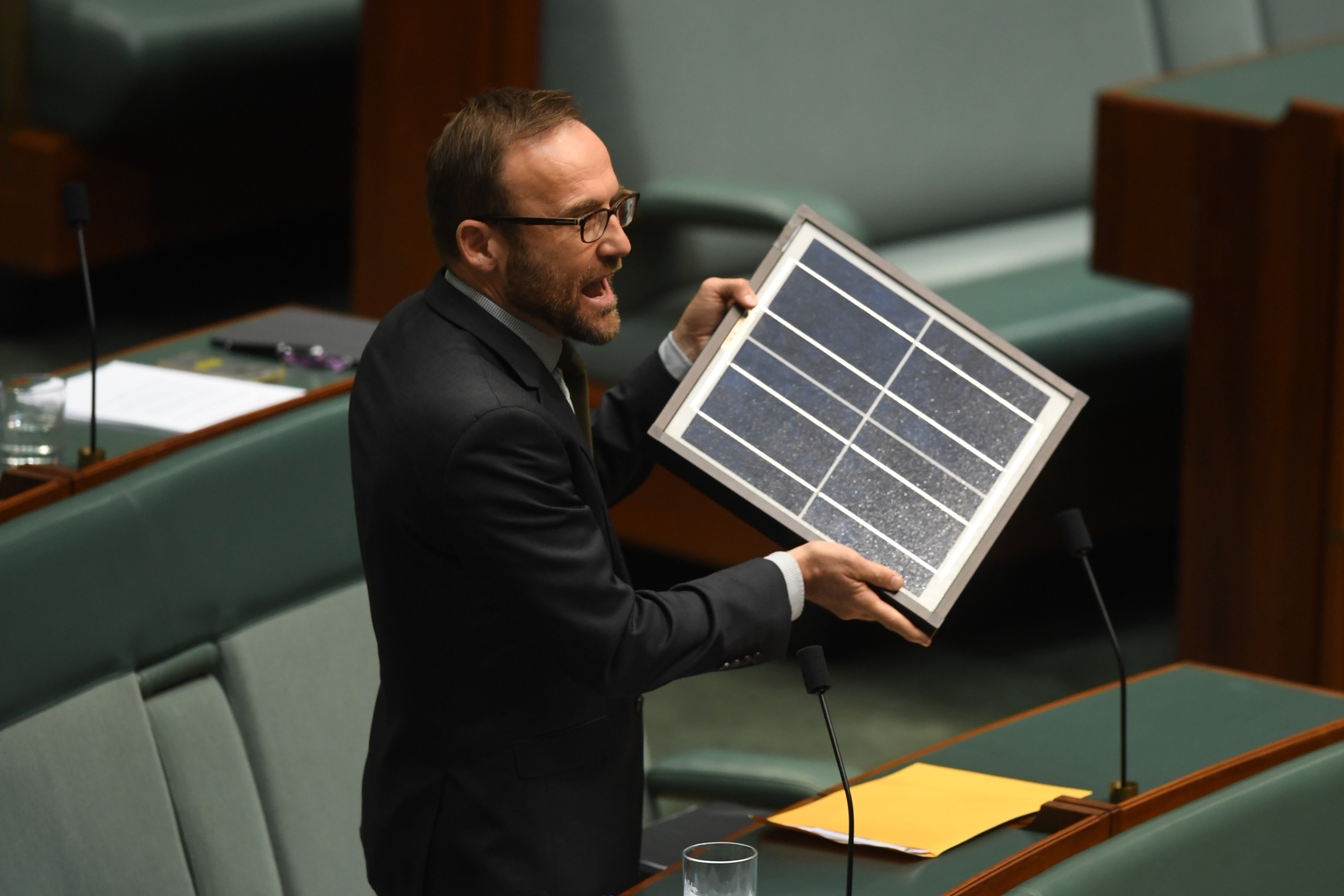 Greens MP Adam Bandt brought a solar panel into the Parliament.