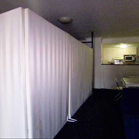 Room dividers in a two-bedroom unit housing up to 10 people in Surry Hills, Sydney. 