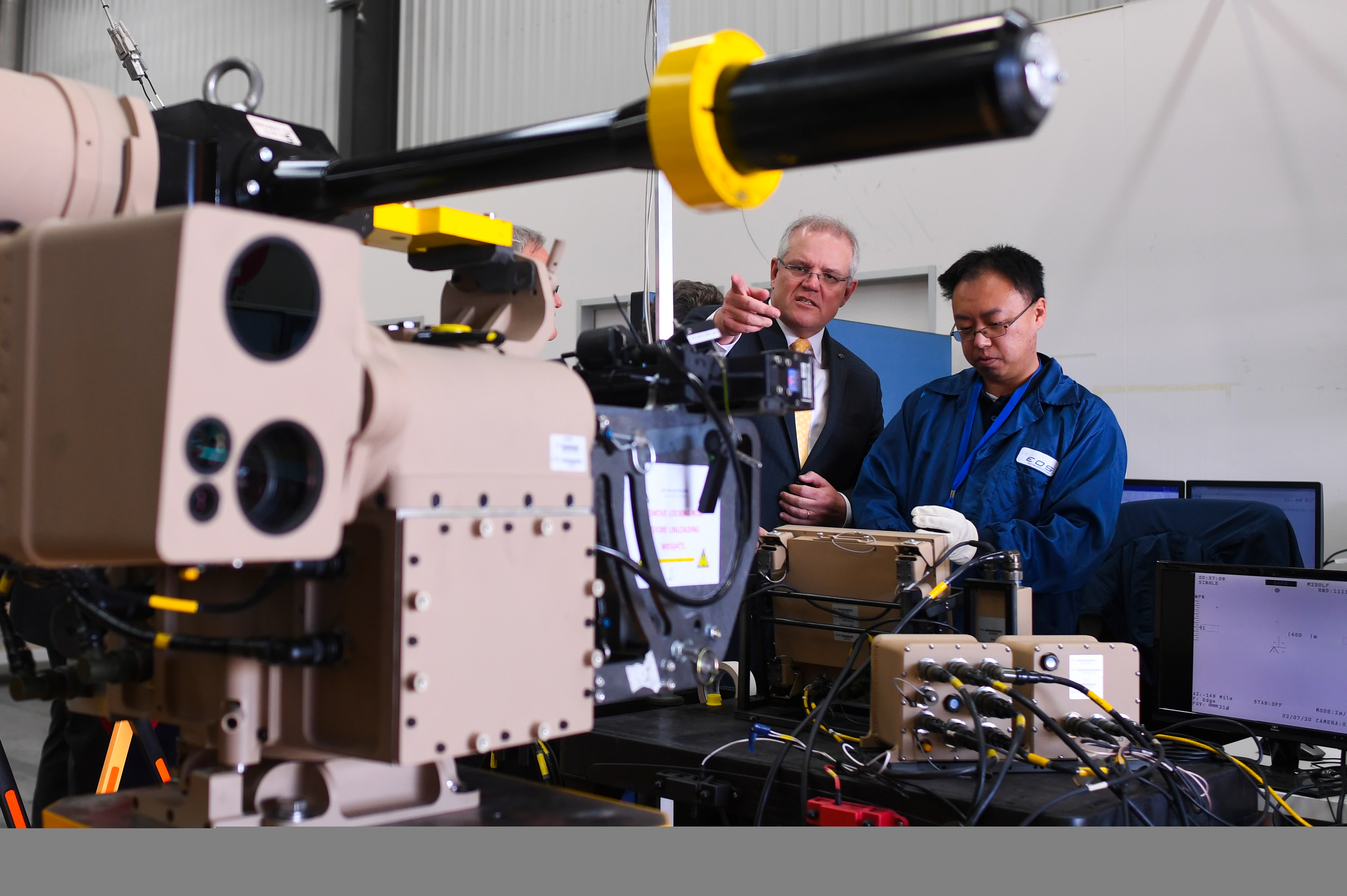 Australian Prime Minister looks at defence machinery during a visit to Electro Optics Systems (EOS) in Canberra.