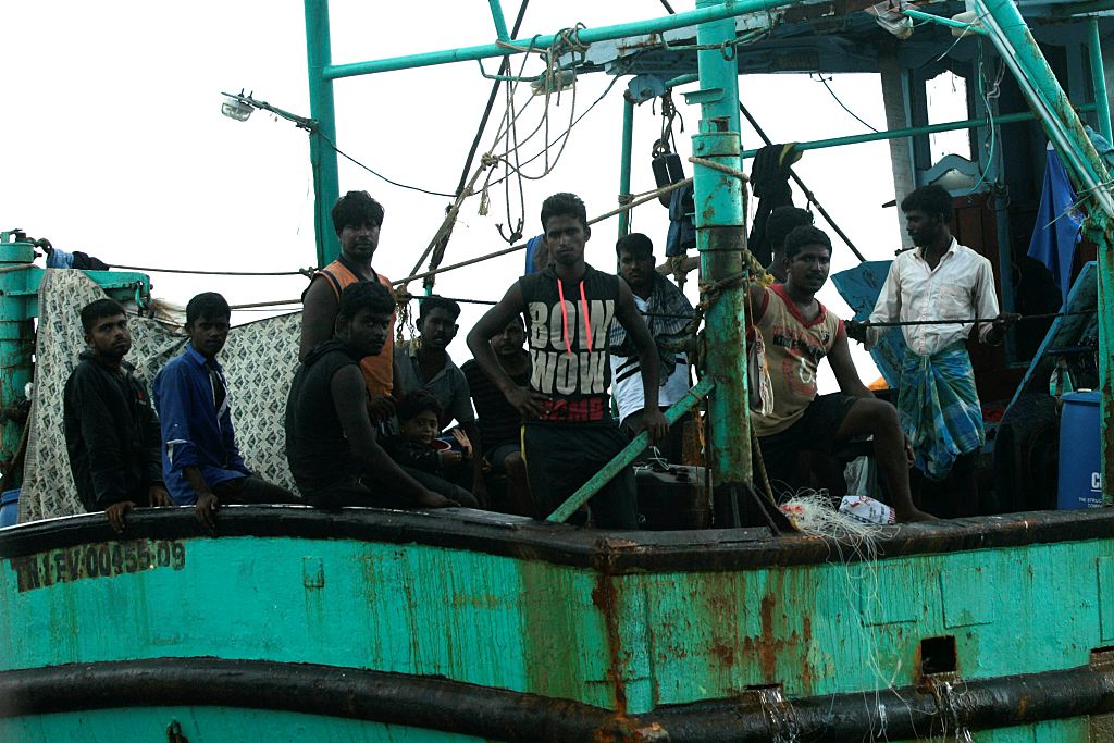 Sri Lanka refugees stay in their boat as they wait for help from the Indonesia Government on the way to Australia on 11 June, 2016.