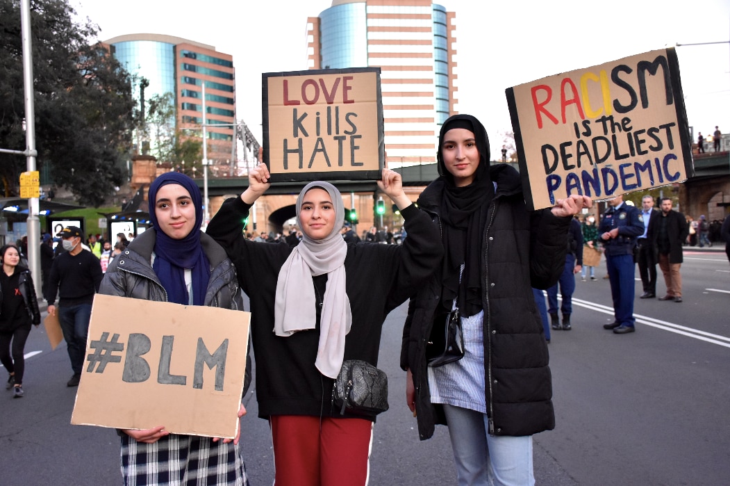 These women were among the thousands of people to march in Sydney These women are showing their support for the Black Lives Matter movement and calling for an end to racism.