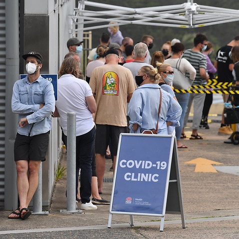 People line up for COVID-19 testing at Mona Vale Hospital's walk-in clinic in Sydney's Northern Beaches. 
