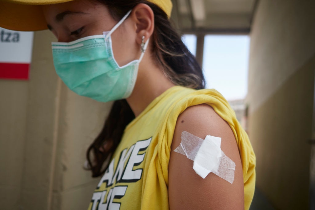 A teenager is vaccinated in Pamplona, Spain.