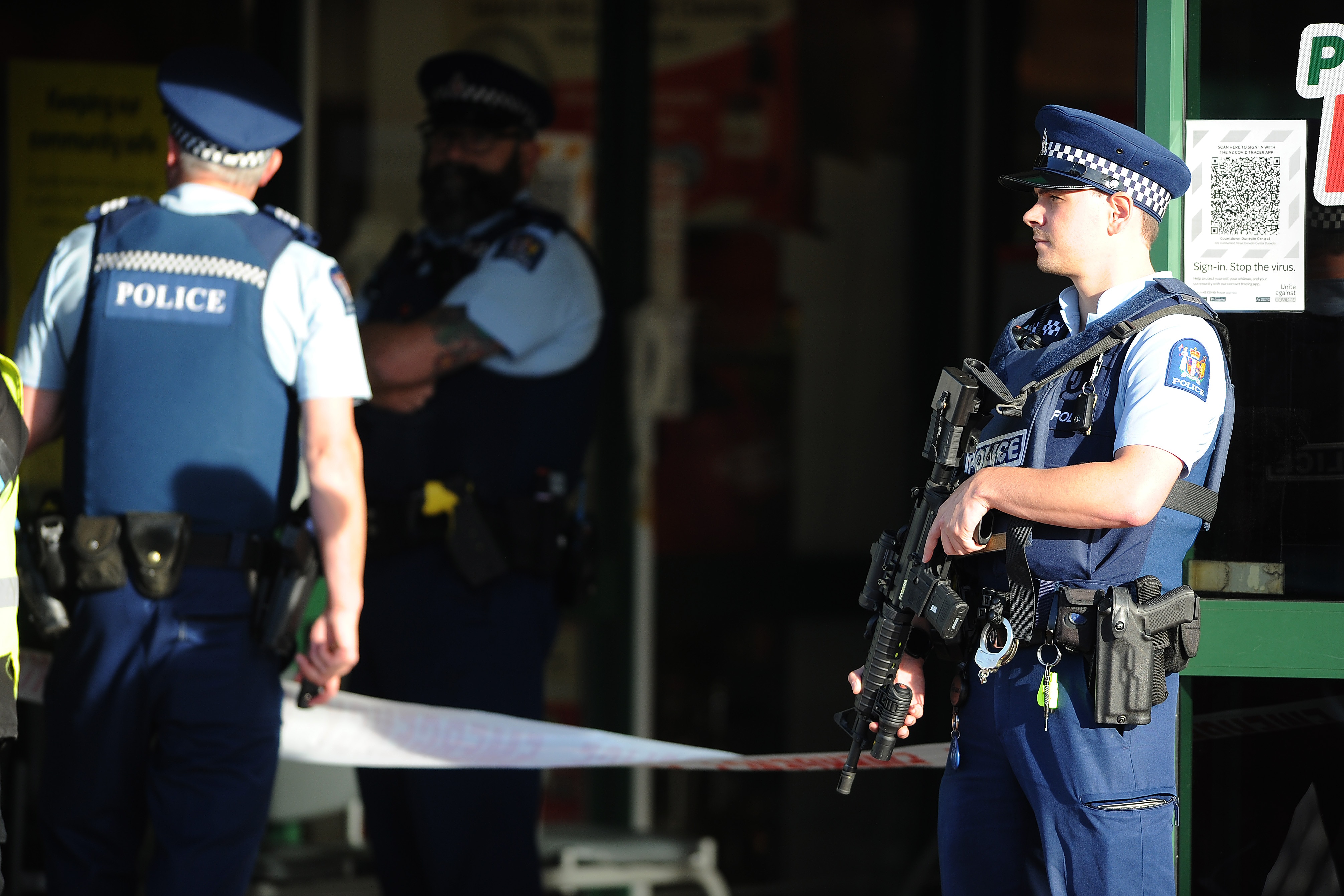 Police officers are observed standing guard outside the main entrance of the Dunedin Central Countdown on 10 May, 2021 in Dunedin, New Zealand. 