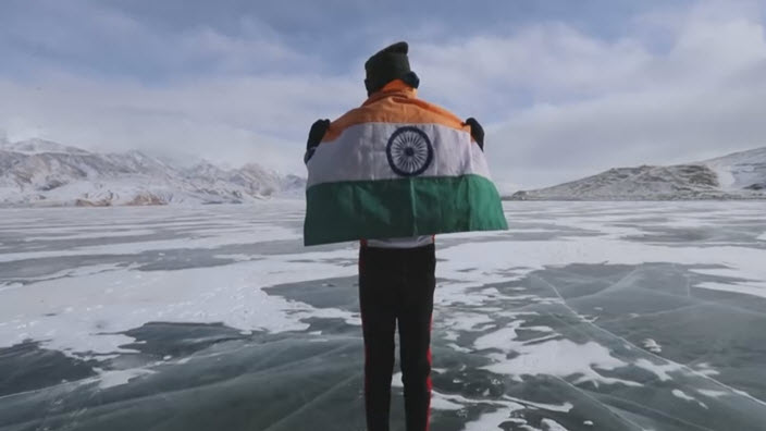 Vishwaraj Jadeja with the India flag at Lake Tsomoriri in Leh.
