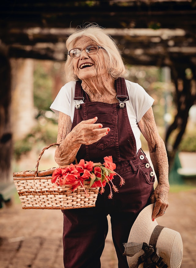Elderly woman doing gardening 