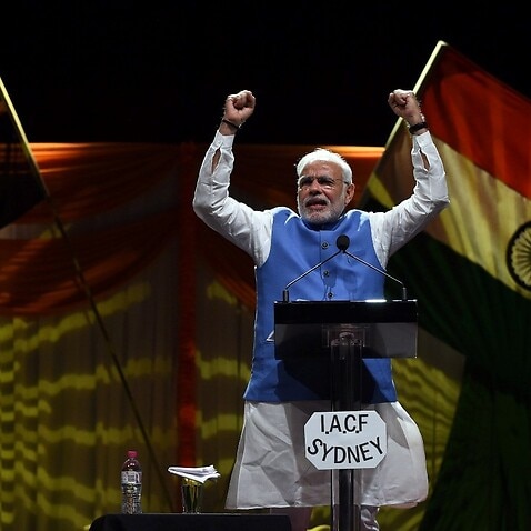Indian Prime Minster Narendra Modi acknowledges his supporters at the Allphones Arena Olympic park in Sydney on 17 November 2014. 