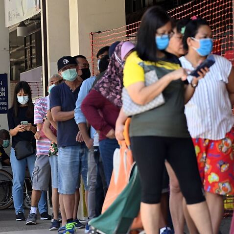 People, wearing face masks as a preventive measure against the spread of the COVID-19 novel coronavirus in Singapore