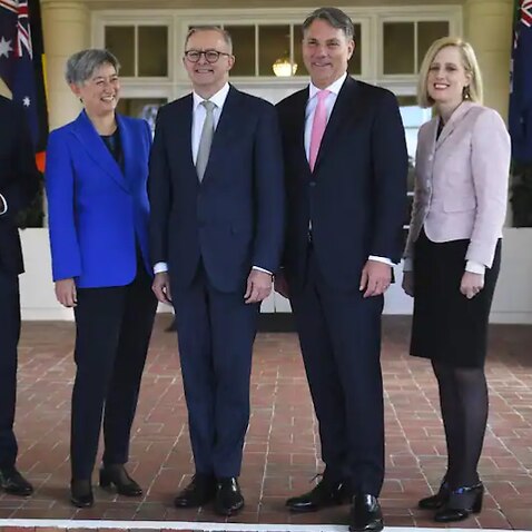 Australian Prime Minister Anthony Albanese (centre) poses for photographs with interim ministers (to left) Treasurer Jim Chalmers and Foreign Minister Penny Wong and (to right) Deputy Prime Minister Richard Marles and Finance Minister Katy Gallagher after
