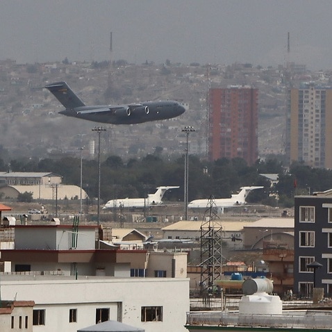 A military aircraft takes off at the Hamid Karzai International Airport in Kabul