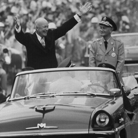 Pres. Dwight D. Eisenhower (L) and Kai Shek Chiang (R) in motorcade during his Eastern good-will tour