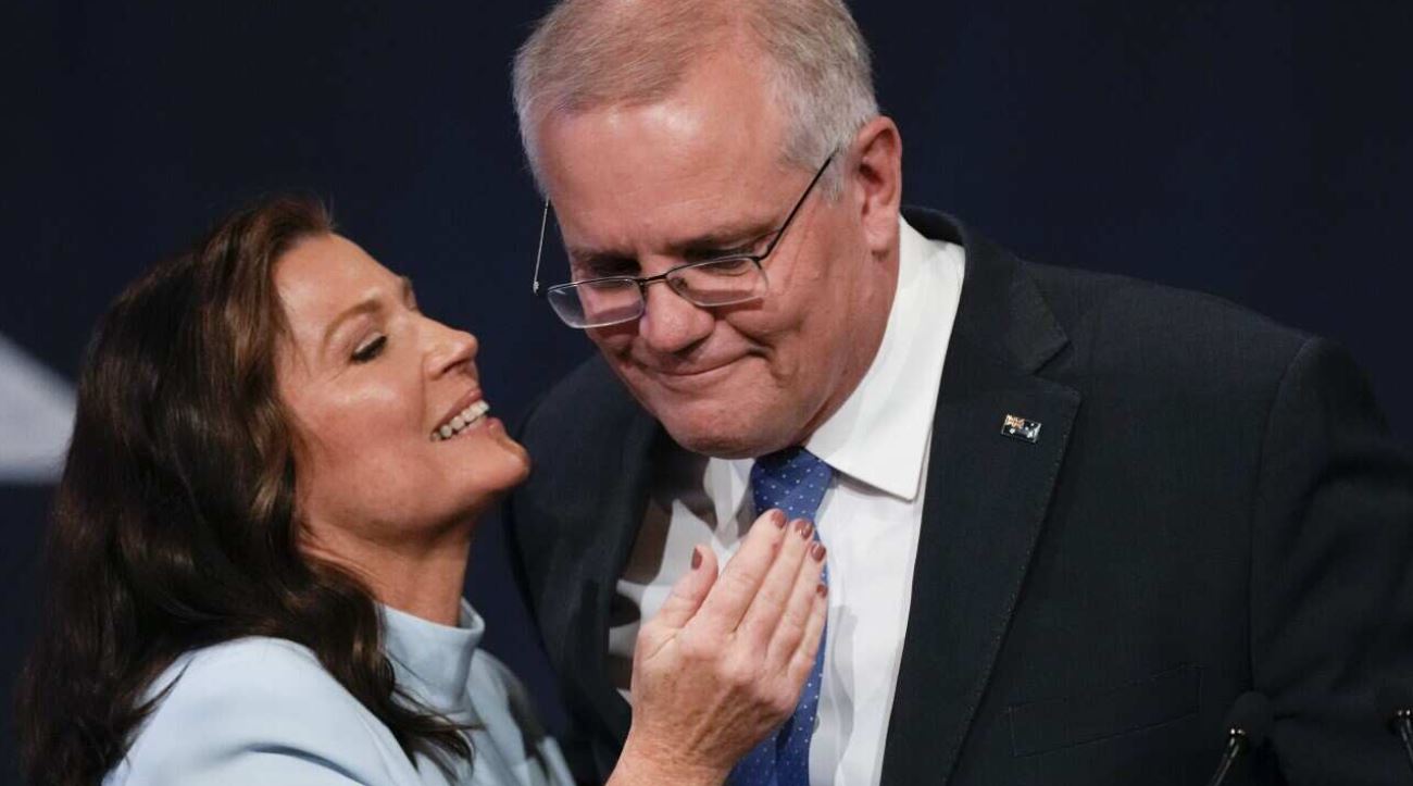 Australian Prime Minister Scott Morrison is embraced by his wife Jenny as he addresses a Liberal Party function in Sydney,