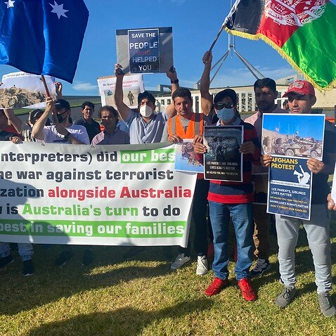 Former Afghan interpreters have rallied outside Parliament House. 