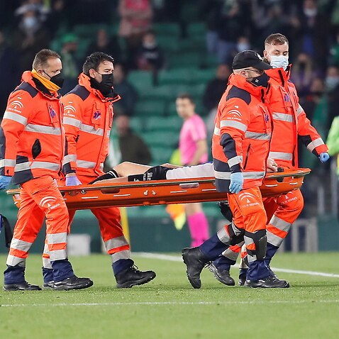Alaves' defender Ruben Duarte leaves the pitch after sustaining an injury during their Spanish LaLiga soccer match between Real Betis and Deportivo Alaves at Benito Villamarin stadium in Seville, Andalusia