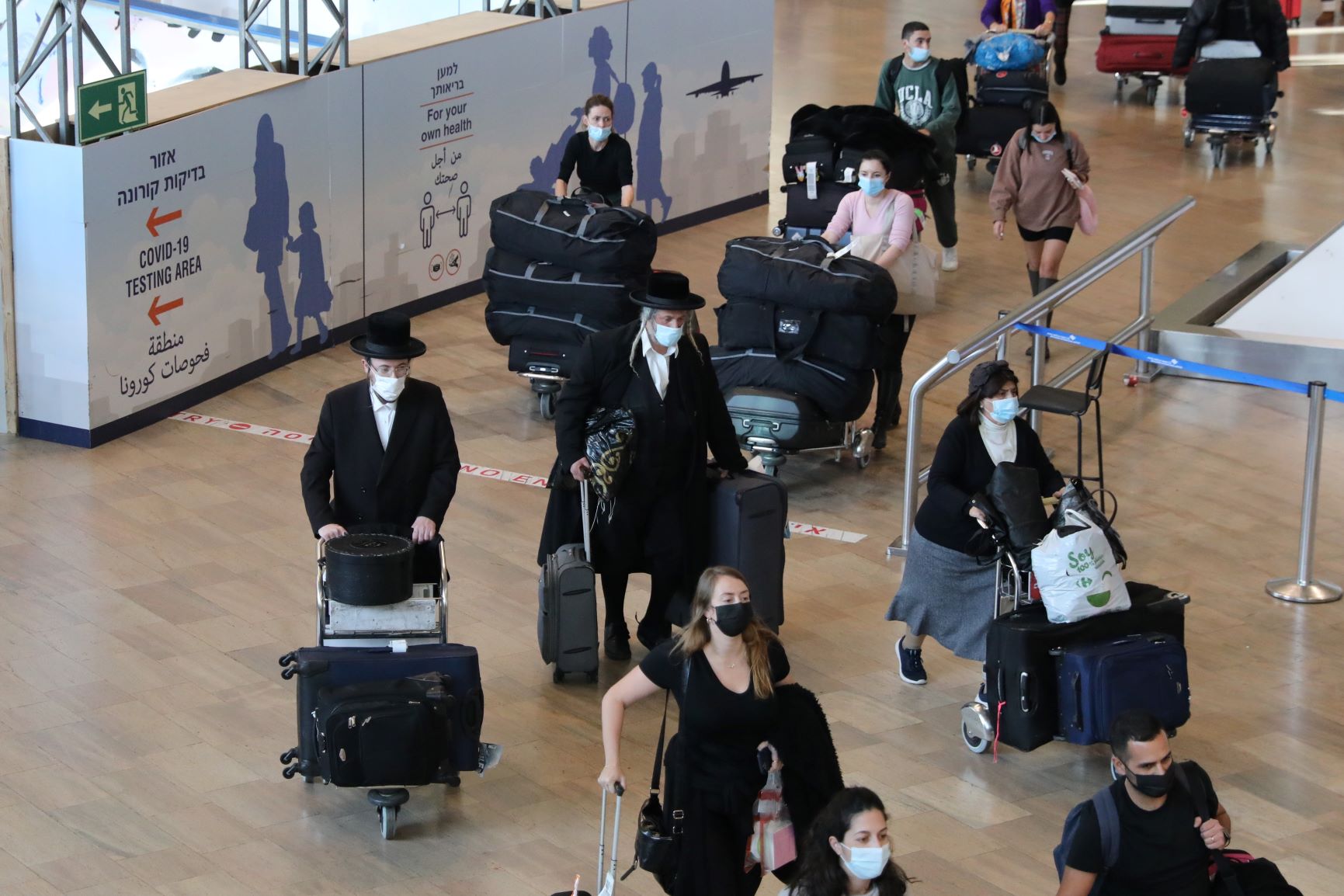 Passengers walk at the Ben Gurion International Airport near Tel Aviv, Israel