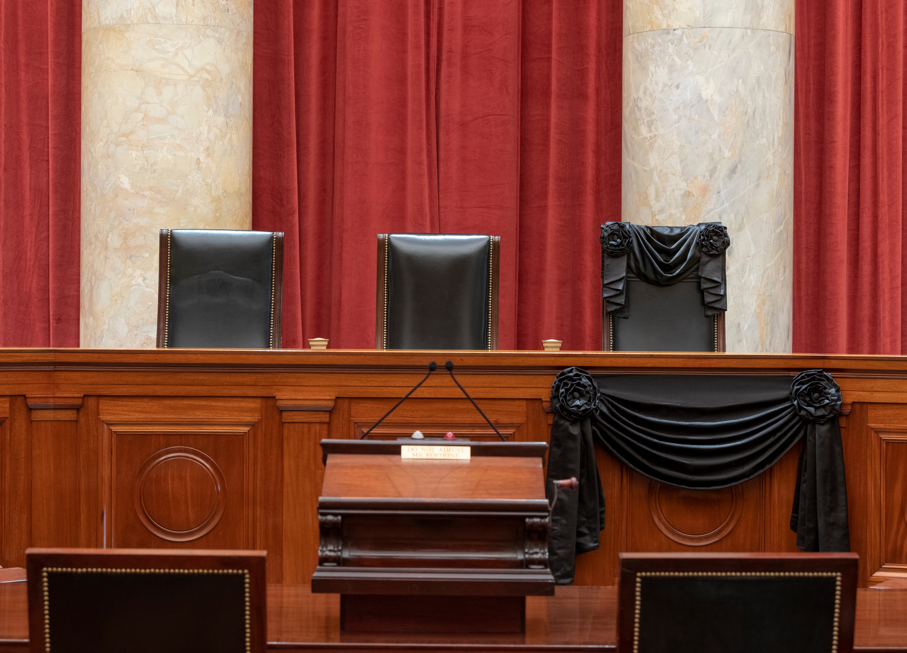 This Sept. 19, 2020, photo provided by the Supreme Court, shows the Bench draped for the death of Supreme Court Justice Ruth Bader Ginsburg.