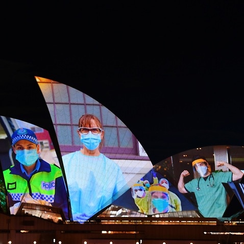 Sails of the Sydney Opera House were lit as a special tribute to frontline workers and vaccinated population in NSW to mark the 80 percent vaccination target