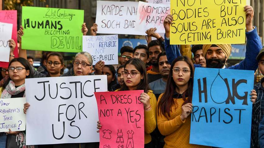 Protesters in Amritsar hold placards during a demonstration seeking for justice for the rape case of a 27-year-old from Hyderabad 