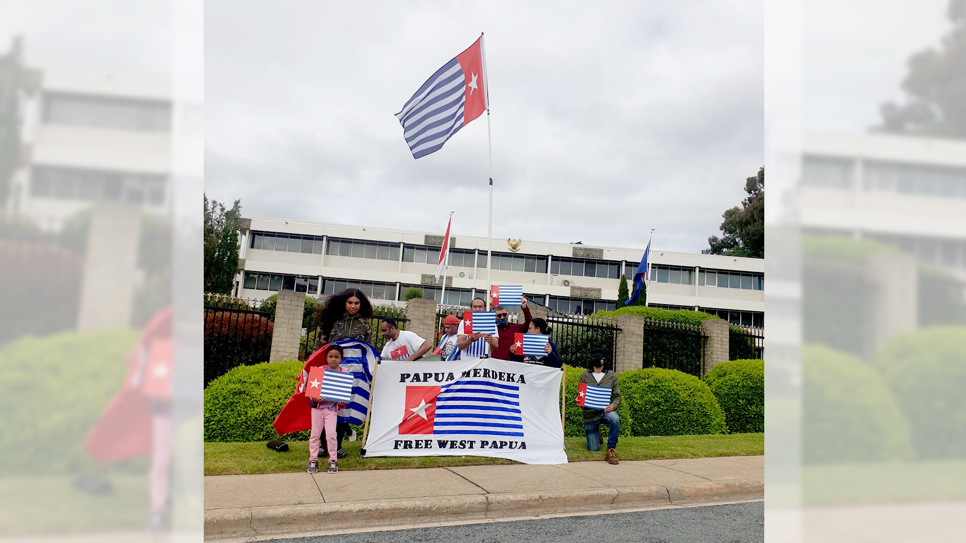 Supporters of West Papuan independence hold the Morning Star flag outside the Indonesian Embassy in Canberra this week.