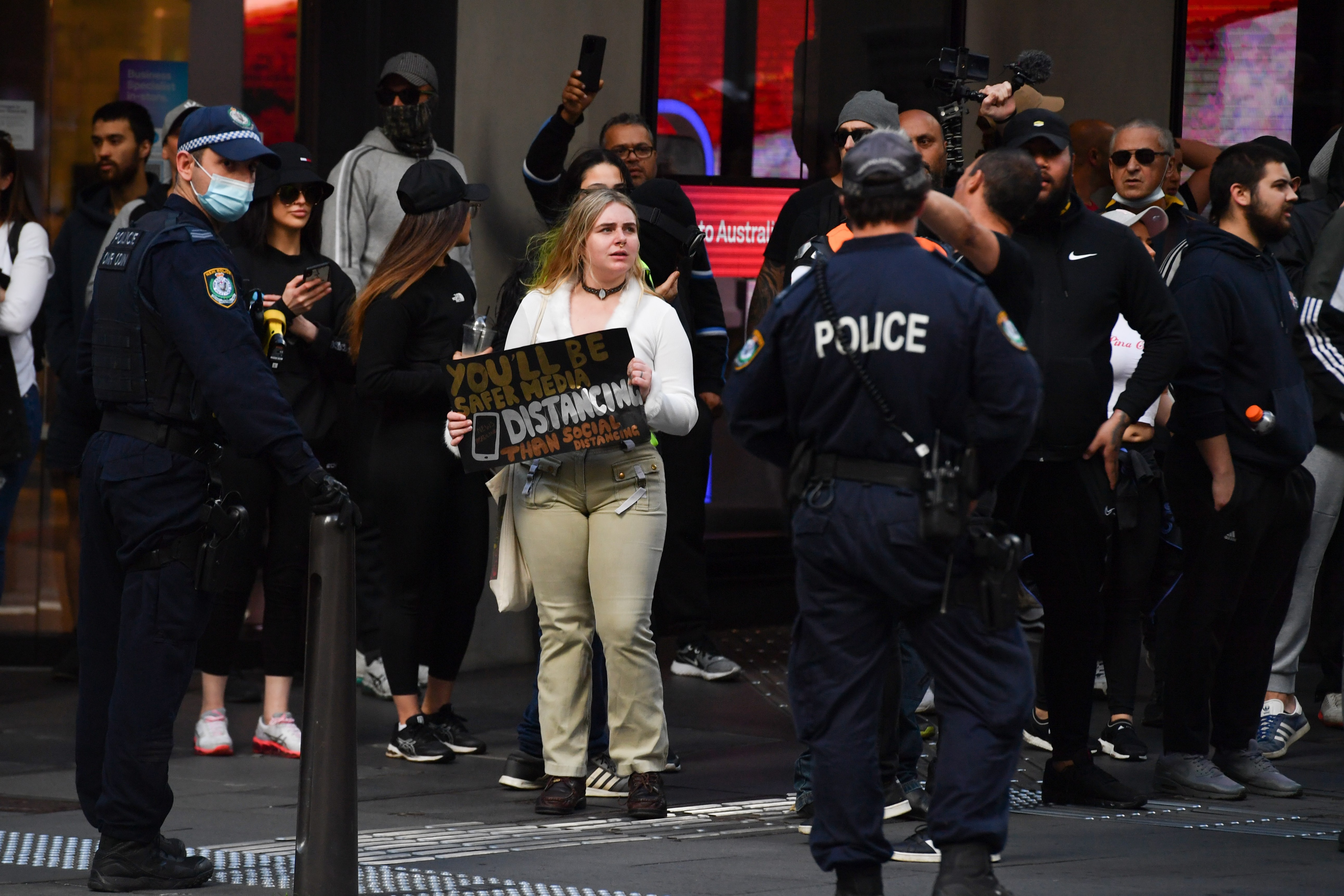 Protesters face off with police near Sydney Town Hall during an anti-lockdown rally at Hyde Park in Sydney.